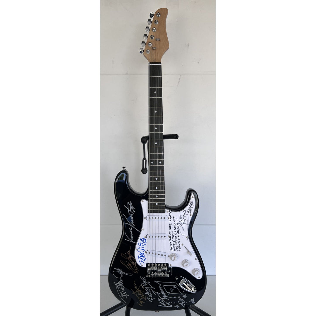 Kiss, Gene Simmons, Paul Stanley, Peter Chris, Ace Frehley  electric guitar signed with proof.