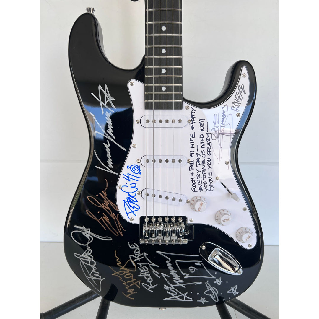 Kiss, Gene Simmons, Paul Stanley, Peter Chris, Ace Frehley  electric guitar signed with proof.