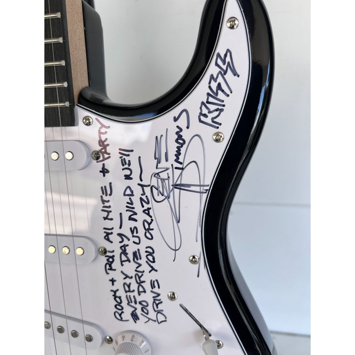 Kiss, Gene Simmons, Paul Stanley, Peter Chris, Ace Frehley  electric guitar signed with proof.