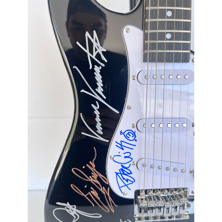Kiss, Gene Simmons, Paul Stanley, Peter Chris, Ace Frehley  electric guitar signed with proof.