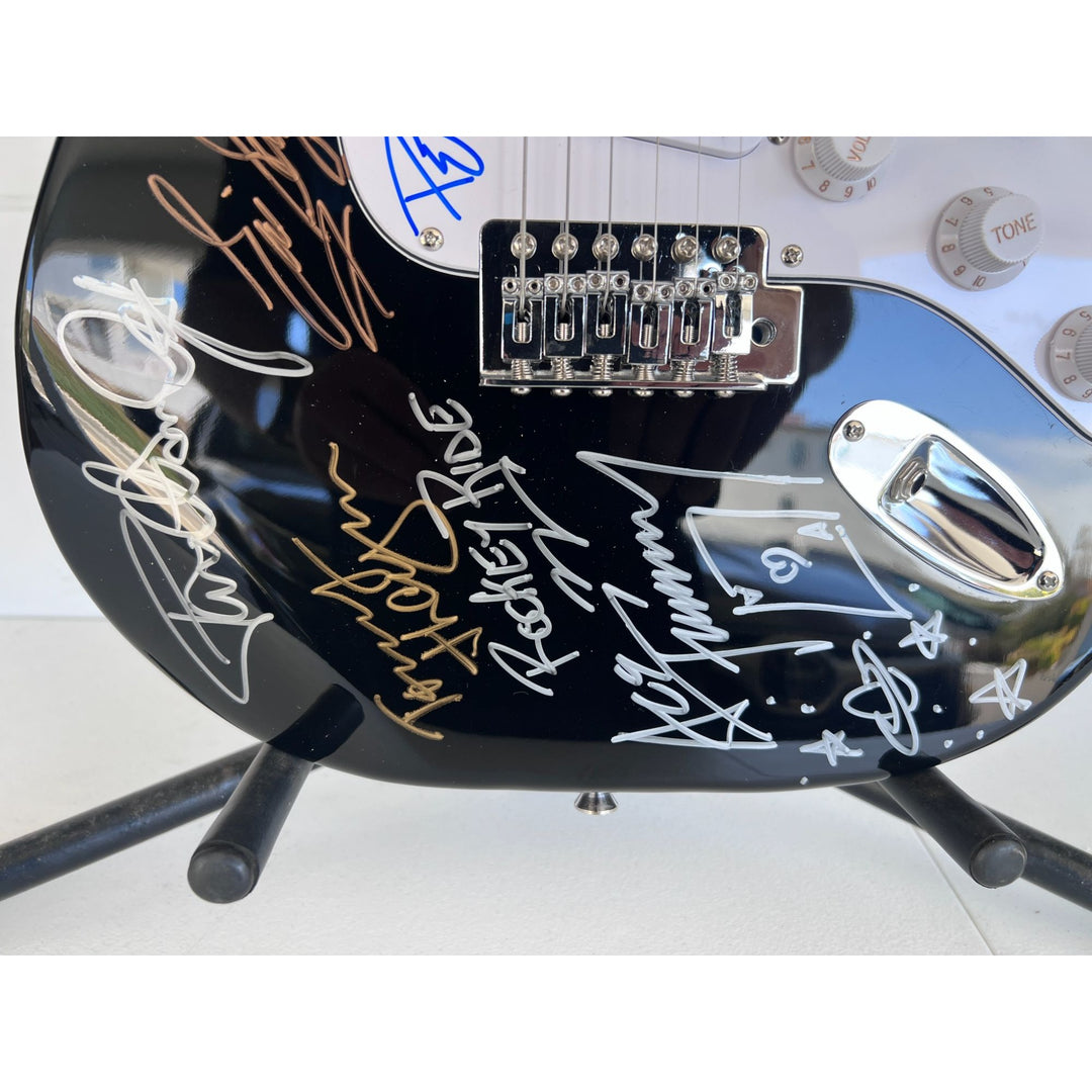 Kiss, Gene Simmons, Paul Stanley, Peter Chris, Ace Frehley  electric guitar signed with proof.