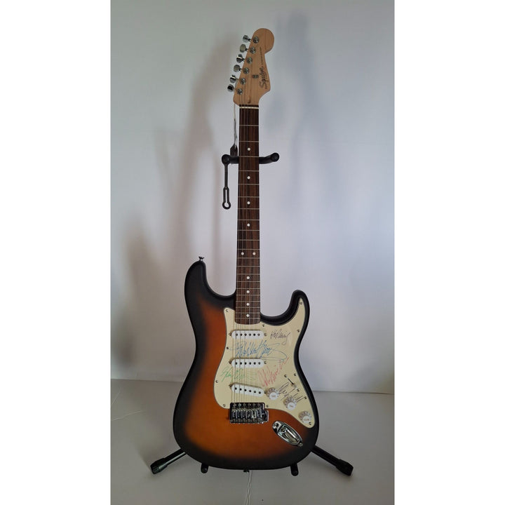 Rob Halford, K.K. Downing, Glenn Tipton, Ian Hill and Dave Holland, Judas Priest, Fender Stratocaster electric guitar signed with proof