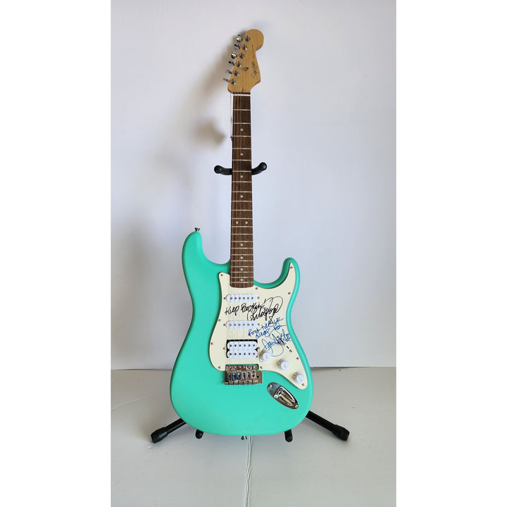 Lita Ford & Joan Jett, signed with inscriptions authentic Fender Stratocaster electric guitar signed with proof