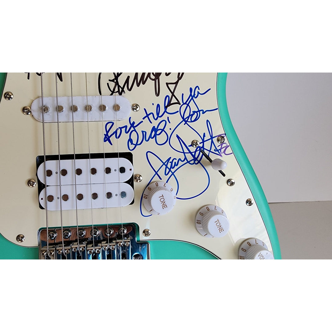 Lita Ford & Joan Jett, signed with inscriptions authentic Fender Stratocaster electric guitar signed with proof