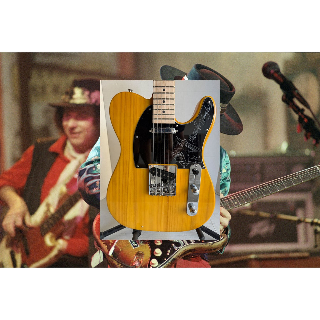 Stevie Ray Vaughan full size telecaster electric guitar signed with proof and sketch.