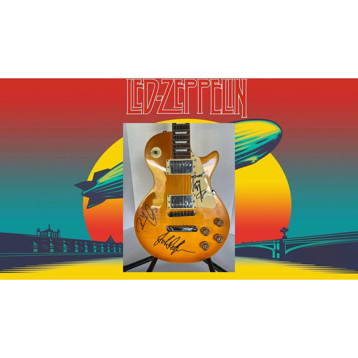 Jimmy Page, Robert Plant, John Paul Jones Led Zeppelin  gold les paul electric guitar signed with proof.