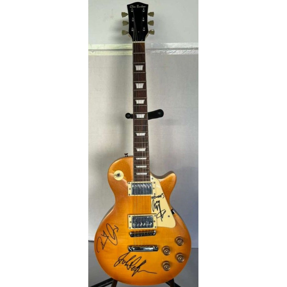 Jimmy Page, Robert Plant, John Paul Jones Led Zeppelin  gold les paul electric guitar signed with proof.