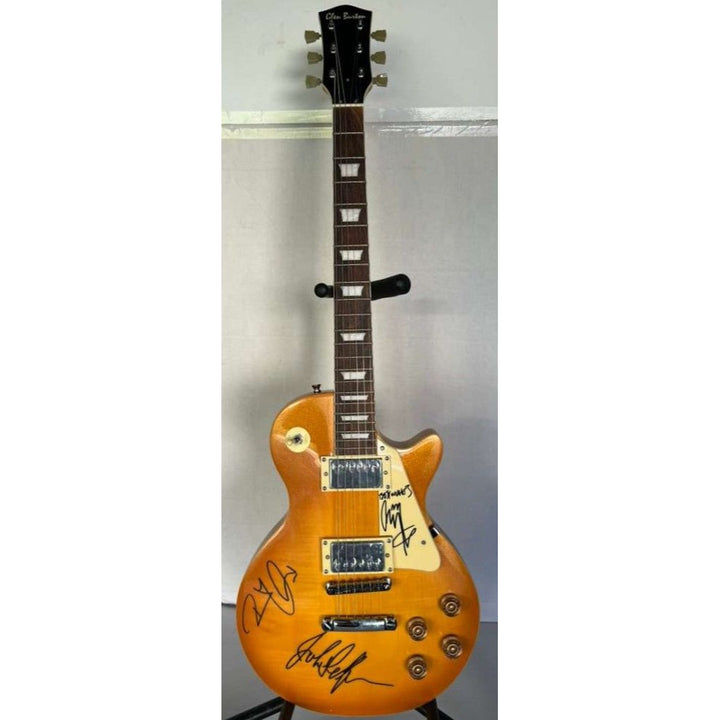 Jimmy Page, Robert Plant, John Paul Jones Led Zeppelin  gold les paul electric guitar signed with proof.