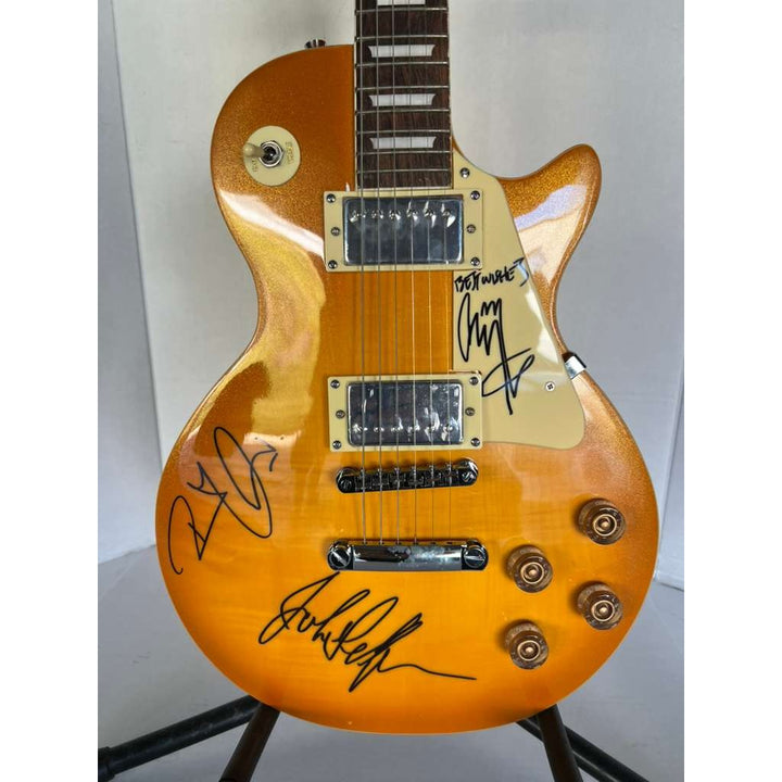 Jimmy Page, Robert Plant, John Paul Jones Led Zeppelin  gold les paul electric guitar signed with proof.
