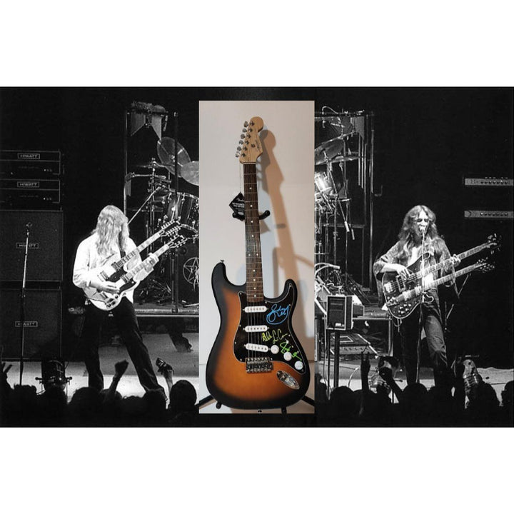 Rush Band signed Neil Peart, Geddy Lee, Alex Lifeson vintage black Fender Stratocaster full size electric guitar signed with proof