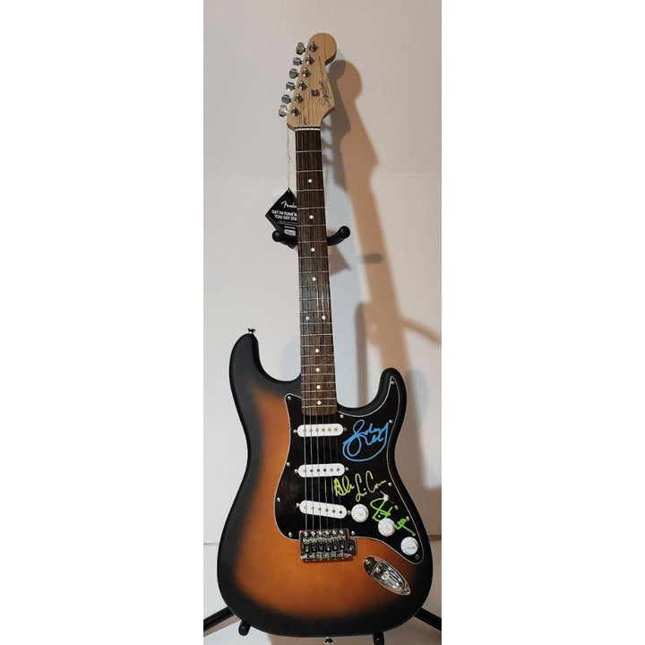 Rush Band signed Neil Peart, Geddy Lee, Alex Lifeson vintage black Fender Stratocaster full size electric guitar signed with proof