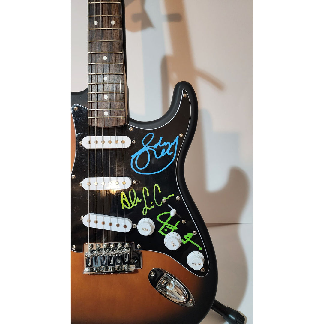 Rush Band signed Neil Peart, Geddy Lee, Alex Lifeson vintage black Fender Stratocaster full size electric guitar signed with proof