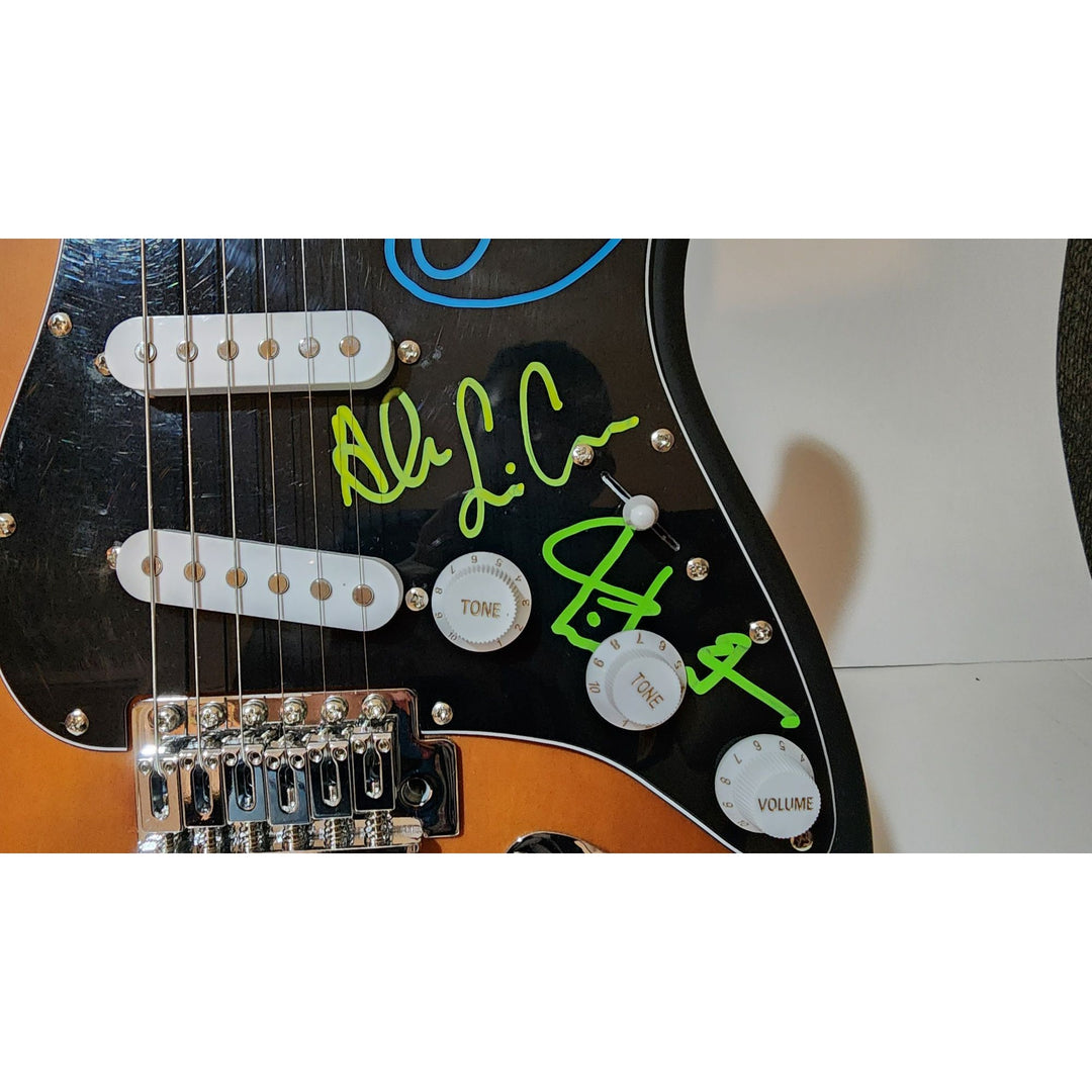Rush Band signed Neil Peart, Geddy Lee, Alex Lifeson vintage black Fender Stratocaster full size electric guitar signed with proof
