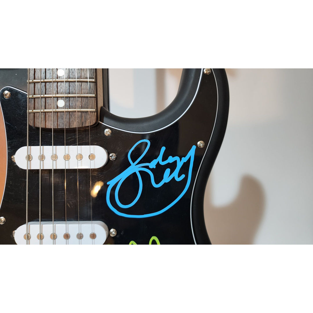 Rush Band signed Neil Peart, Geddy Lee, Alex Lifeson vintage black Fender Stratocaster full size electric guitar signed with proof