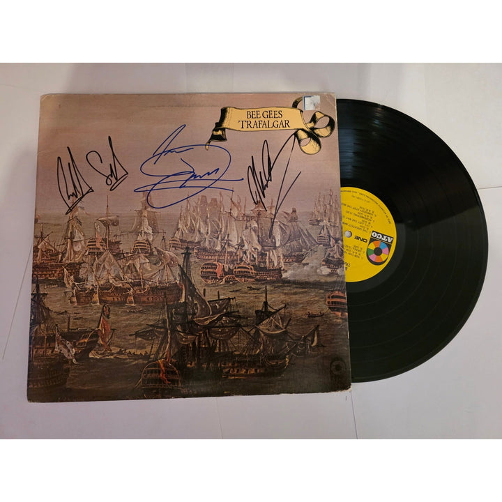 Barry, Robin and Maurice Gibb Bee Gees "Trafalgar" LP signed with proof.
