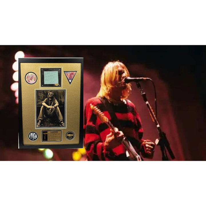 Kurt Cobain Nirvana signed with inscription autograph page book and a museum quality frame 27x36.