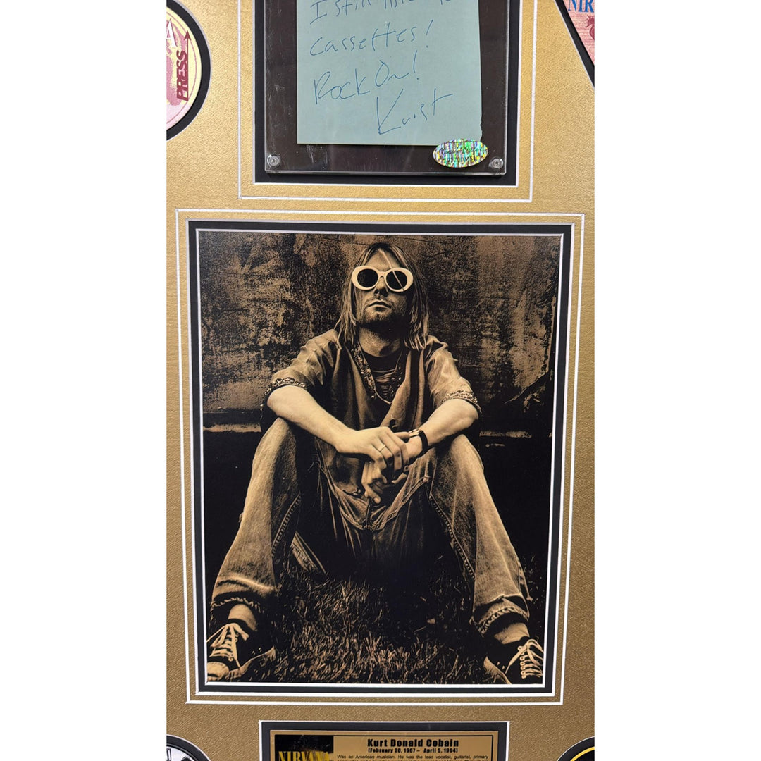 Kurt Cobain Nirvana signed with inscription autograph page book and a museum quality frame 27x36.