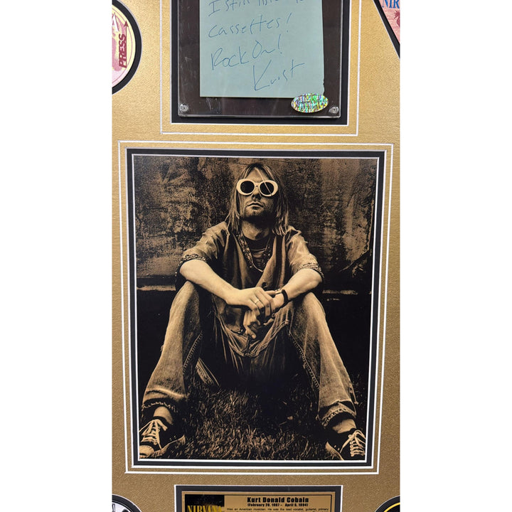Kurt Cobain Nirvana signed with inscription autograph page book and a museum quality frame 27x36.