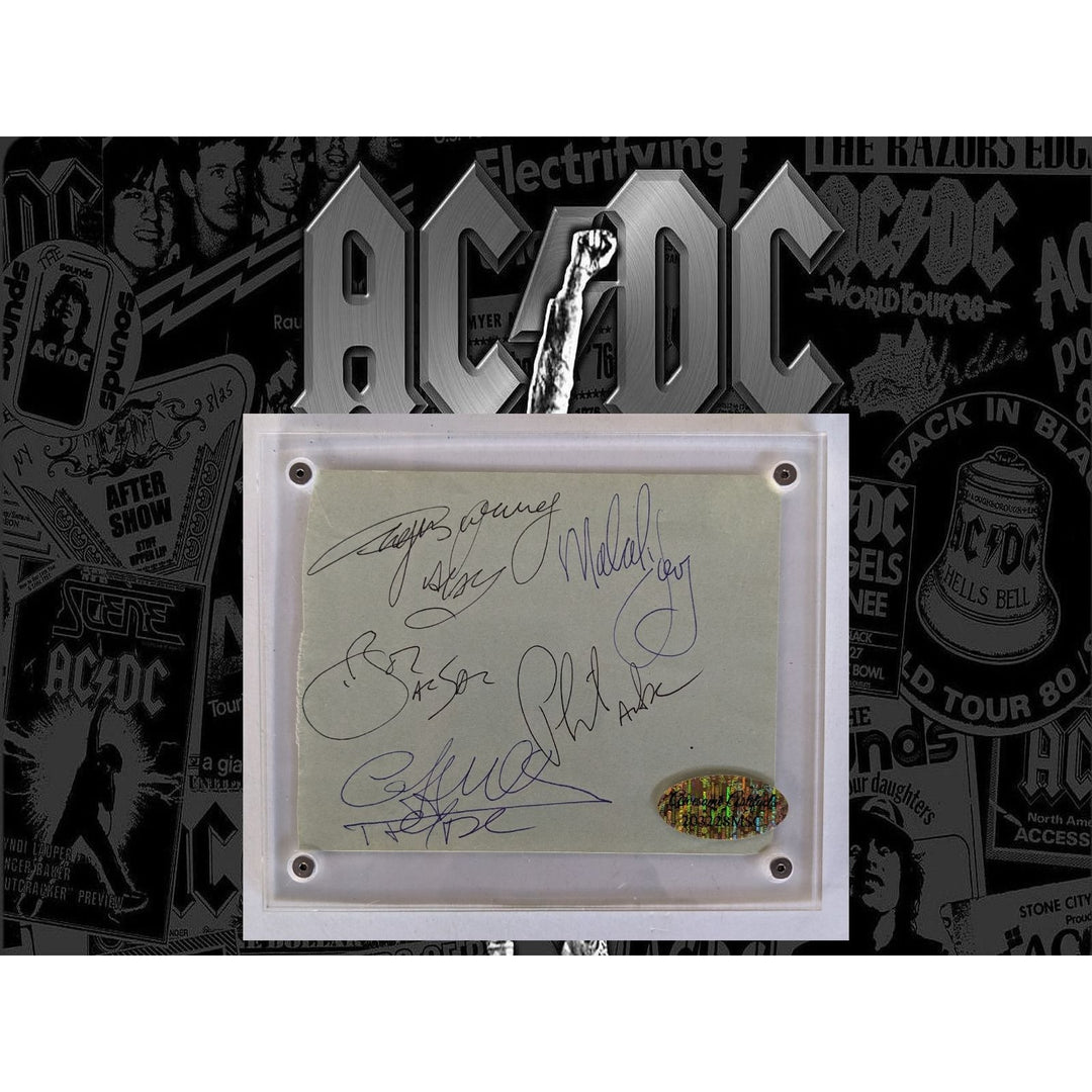 Bon Scott, Angus & Malcolm Young, Cliff Williams, Phil Rudd AC/DC Vintage autograph book page signed with proof
