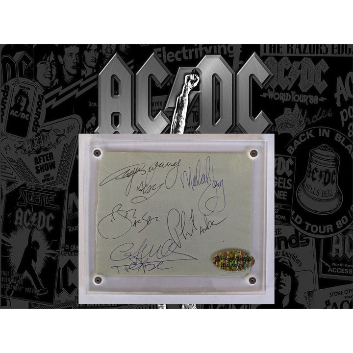 Bon Scott, Angus & Malcolm Young, Cliff Williams, Phil Rudd AC/DC Vintage autograph book page signed with proof