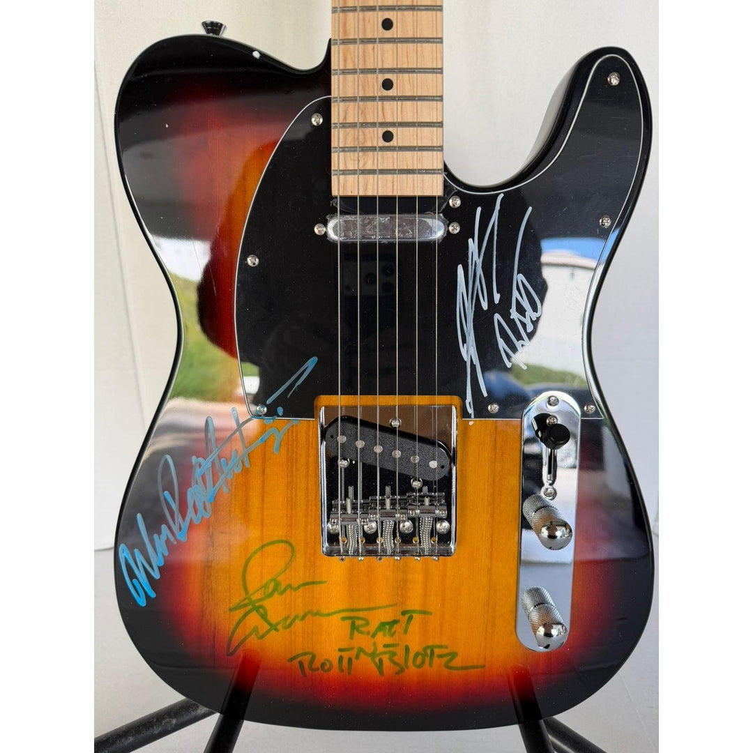 Ratt telecaster electric guitar signed by Warren DeMartini, Stephen Pearcy, Bobby Blotzer, and Juan Croucier.