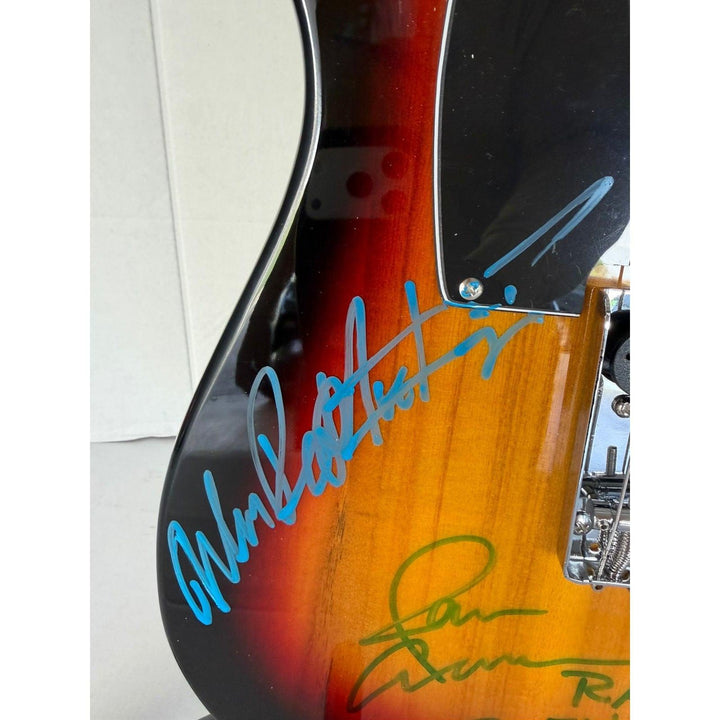 Ratt telecaster electric guitar signed by Warren DeMartini, Stephen Pearcy, Bobby Blotzer, and Juan Croucier.
