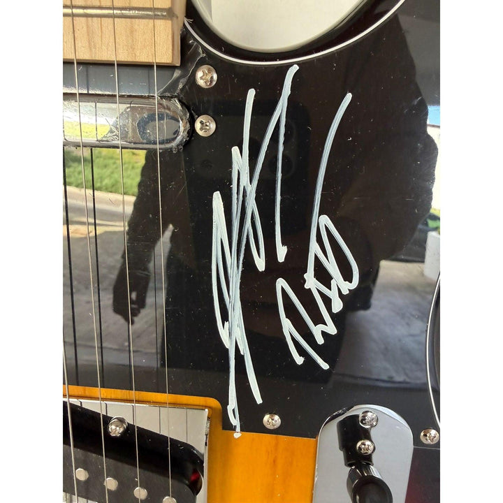 Ratt telecaster electric guitar signed by Warren DeMartini, Stephen Pearcy, Bobby Blotzer, and Juan Croucier.