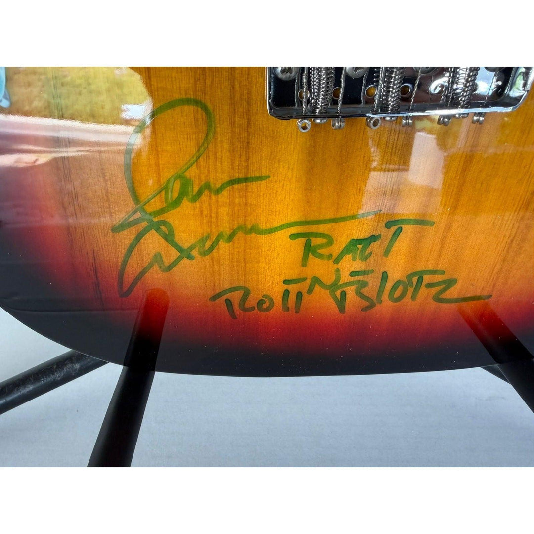 Ratt telecaster electric guitar signed by Warren DeMartini, Stephen Pearcy, Bobby Blotzer, and Juan Croucier.