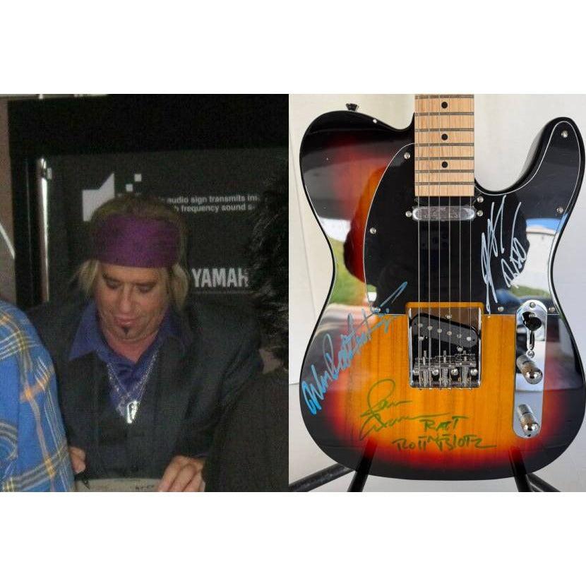 Ratt telecaster electric guitar signed by Warren DeMartini, Stephen Pearcy, Bobby Blotzer, and Juan Croucier.