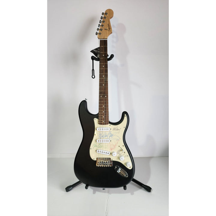 Judas Priest, Rob Halford, K.K. Downing, Glenn Tipton, Ian Hill and Dave Holland, Fender Stratocaster electric guitar signed with proof