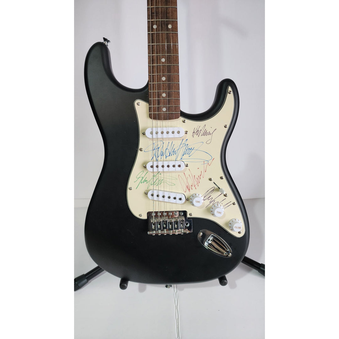 Judas Priest, Rob Halford, K.K. Downing, Glenn Tipton, Ian Hill and Dave Holland, Fender Stratocaster electric guitar signed with proof