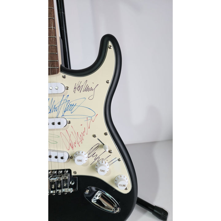 Judas Priest, Rob Halford, K.K. Downing, Glenn Tipton, Ian Hill and Dave Holland, Fender Stratocaster electric guitar signed with proof