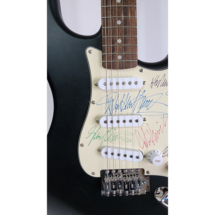 Judas Priest, Rob Halford, K.K. Downing, Glenn Tipton, Ian Hill and Dave Holland, Fender Stratocaster electric guitar signed with proof