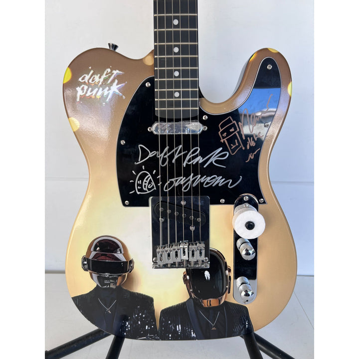 Daft Punk (Thomas Bangalter & Guy Manuel de Homem-Christo) signed with sketch on "One of a Kind" telecaster full size electric guitar.