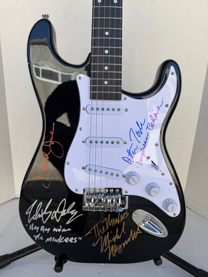 The Monkees Michael Nesmith, Peter Tork, Micky Dolenz, and Davey Jones full size Stratocaster electric guitar signed with proof