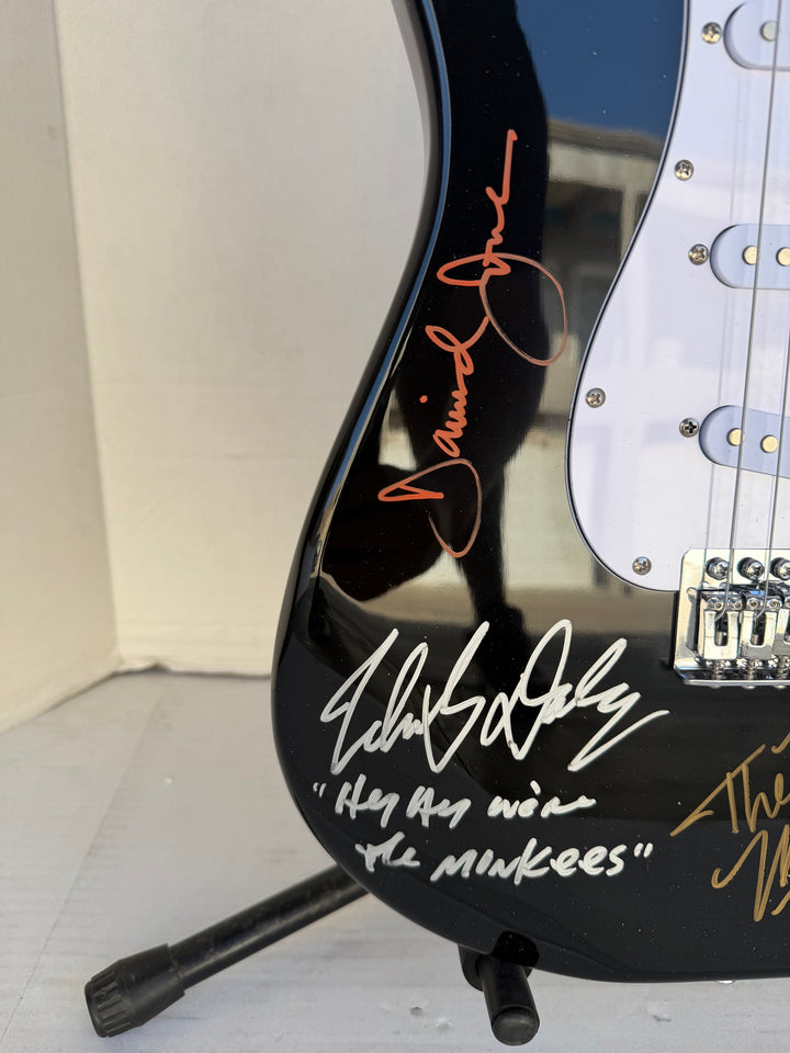 The Monkees Michael Nesmith, Peter Tork, Micky Dolenz, and Davey Jones full size Stratocaster electric guitar signed with proof