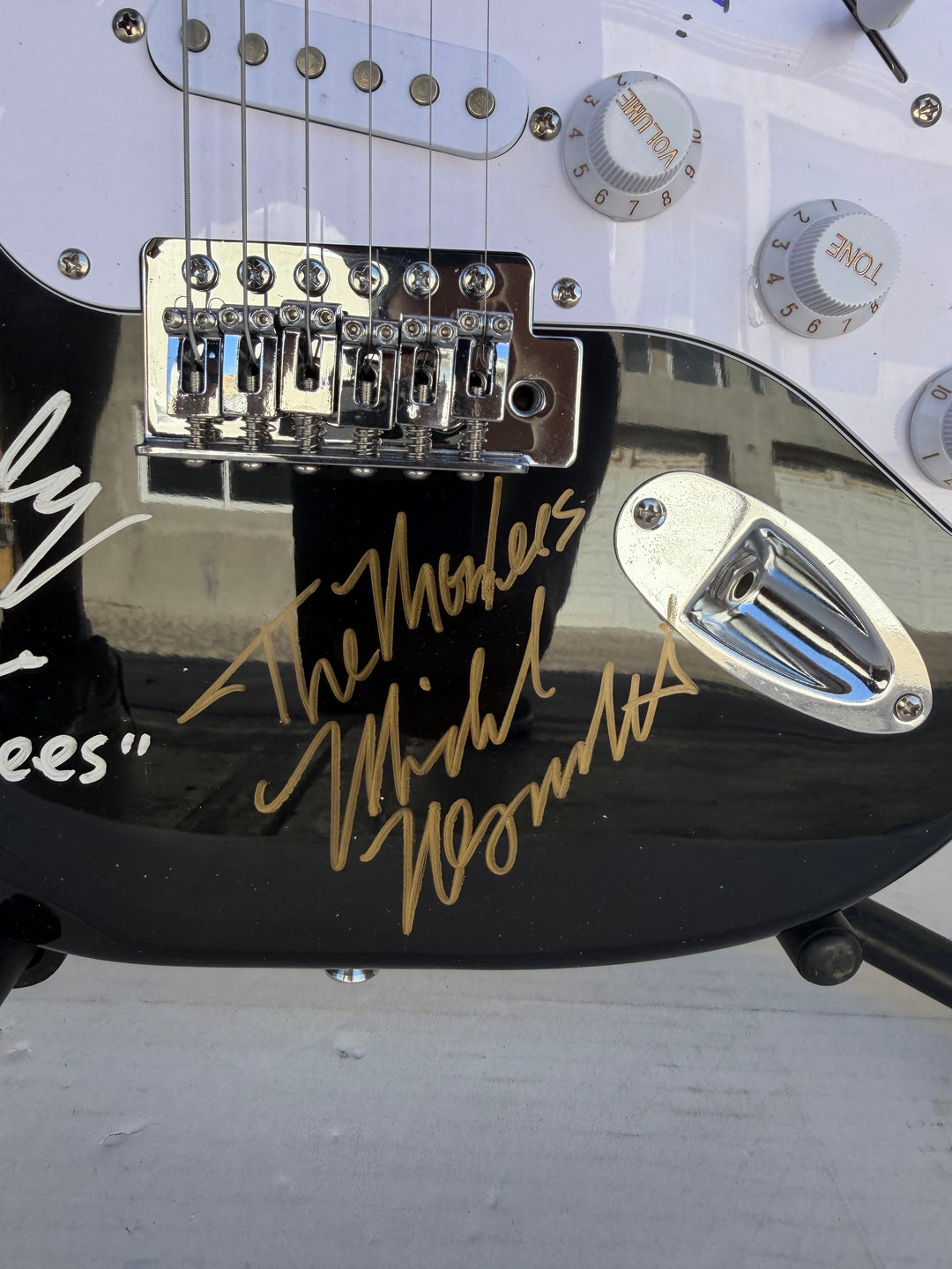 The Monkees Michael Nesmith, Peter Tork, Micky Dolenz, and Davey Jones full size Stratocaster electric guitar signed with proof