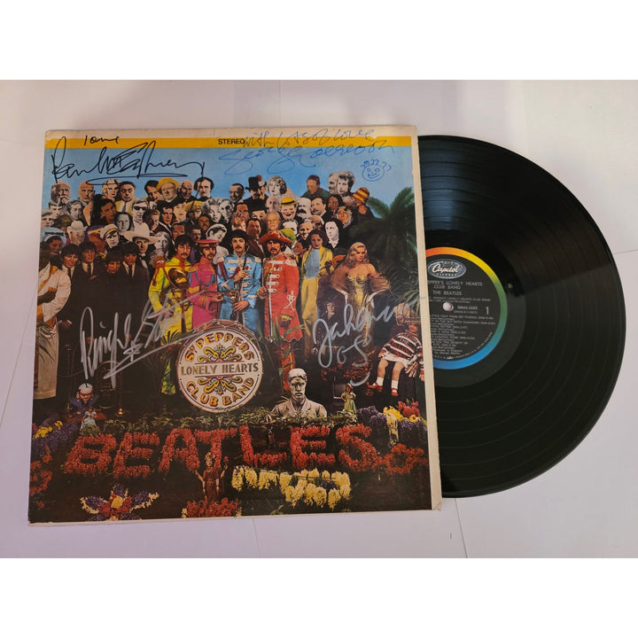 The Beatles "Sgt. Pepper's Lonely Hearts Club Band" LP signed with proof.
