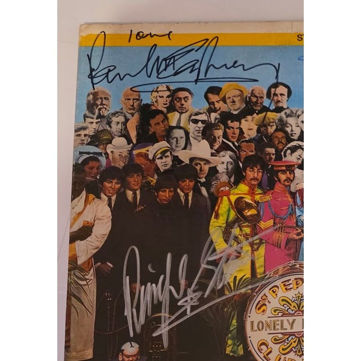 The Beatles "Sgt. Pepper's Lonely Hearts Club Band" LP signed with proof.