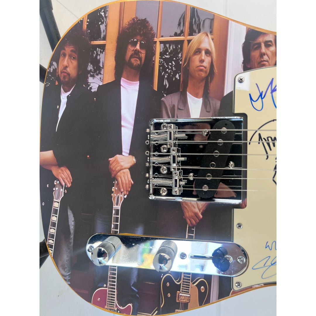 Traveling  Wilburys Roy Orbison Jeff Lynne Bob Dylan Tom Petty George Harrison full size electric guitar signed  with proof.