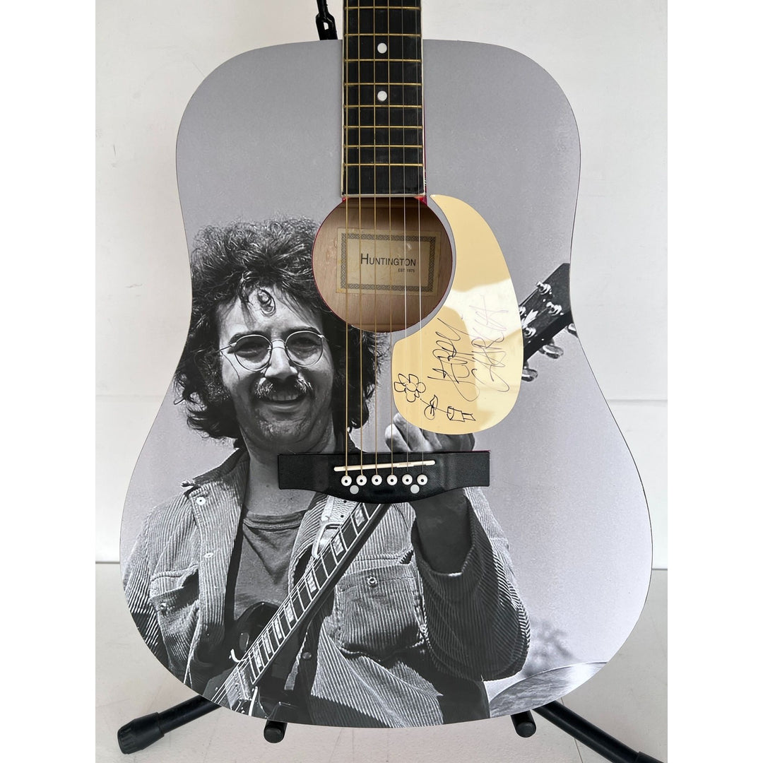 Jerry García legendary front man of the Grateful Dead (one of a kind acoustic guitar) signed with sketch & proof.