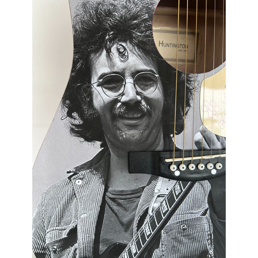 Jerry García legendary front man of the Grateful Dead (one of a kind acoustic guitar) signed with sketch & proof.