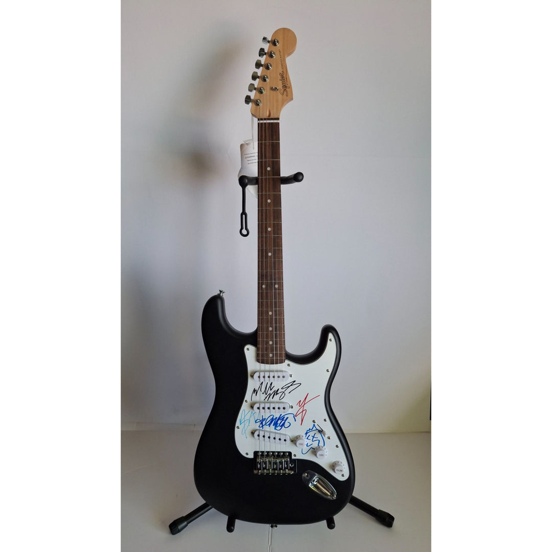 Motley Crue, Tommy Lee, Mick Mars, Nixxi Sixx, Vince Neal, Fender Stratocaster Squier electric guitar signed with proof