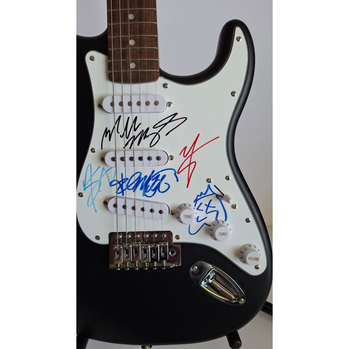 Motley Crue, Tommy Lee, Mick Mars, Nixxi Sixx, Vince Neal, Fender Stratocaster Squier electric guitar signed with proof