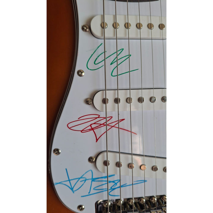 Metallica vintage signed James Hetfield, Lars Ulrich, Kirk Hammett, Jason Newst Fender Stratocaster Squier electric guitar signed with proof
