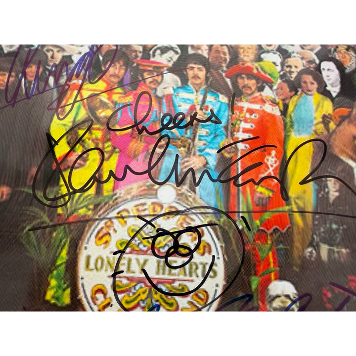 Sir George MartinRingo Starr Paul McCartney  drumhead signed with proof.