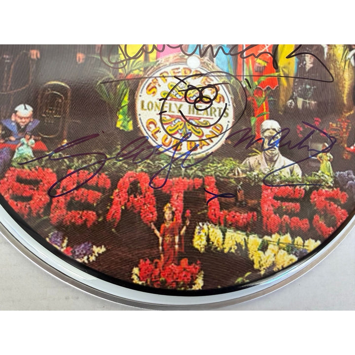 Sir George MartinRingo Starr Paul McCartney  drumhead signed with proof.