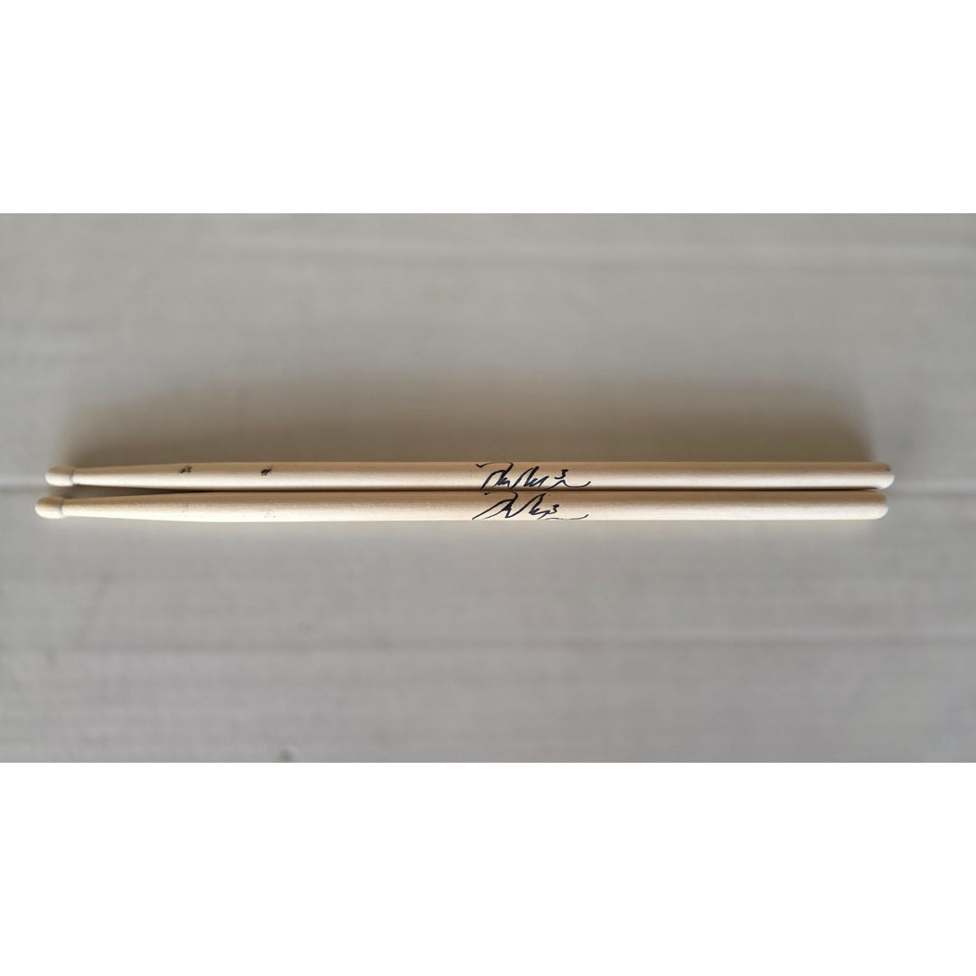 Taylor Hawkins Foo Fighters pair of drumsticks signed with proof.