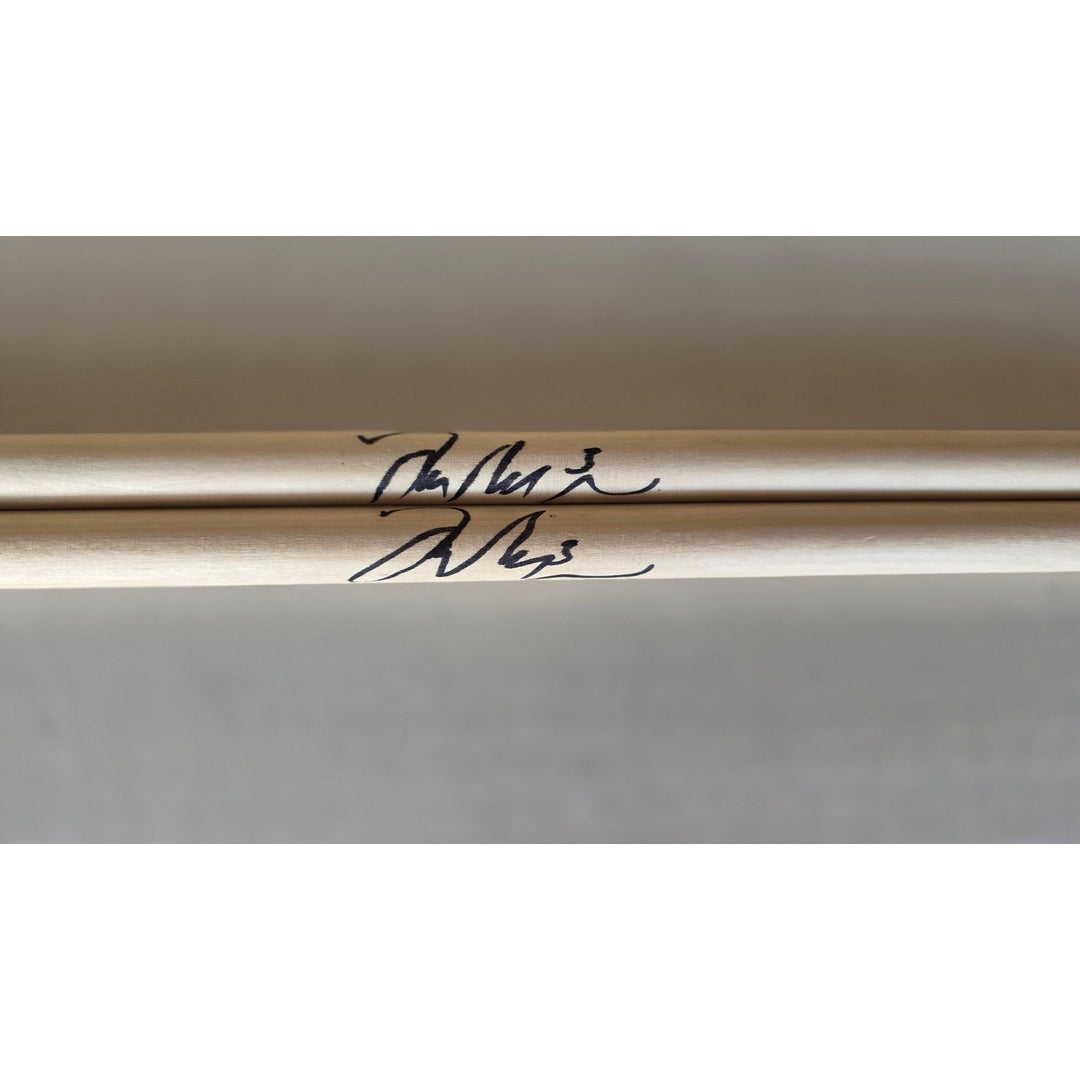 Taylor Hawkins Foo Fighters pair of drumsticks signed with proof.