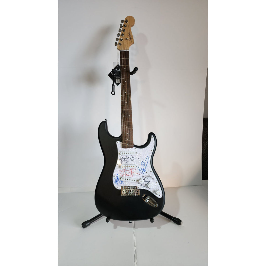 Oasis: Noel & Liam Gallagher, Fender Stratocaster electric guitar signed with proof